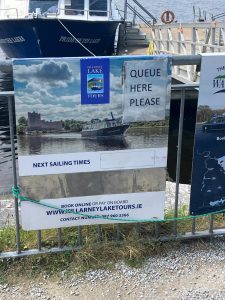 a sign for Killarney Lake Tours