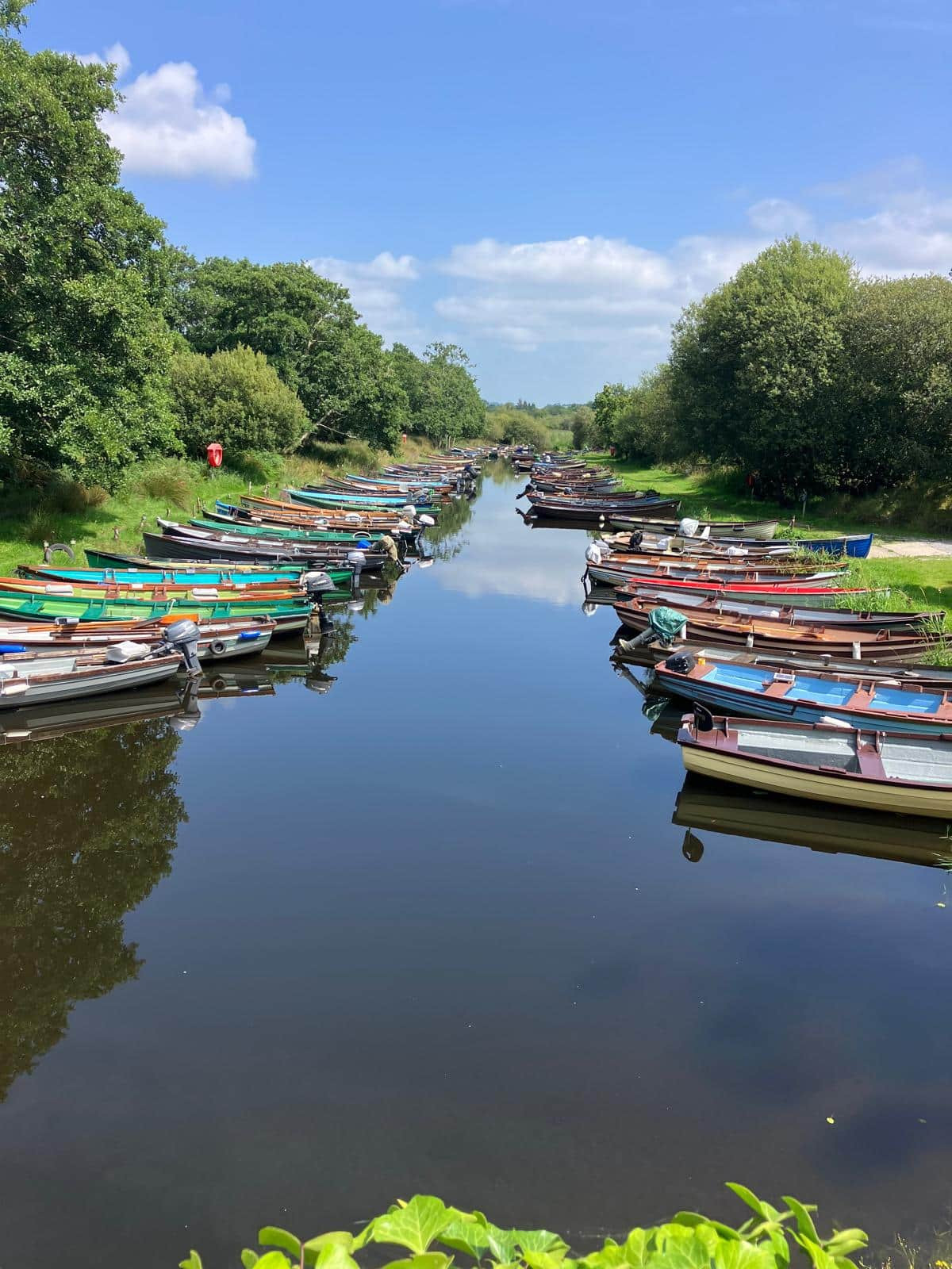 many small colourful boats lined up